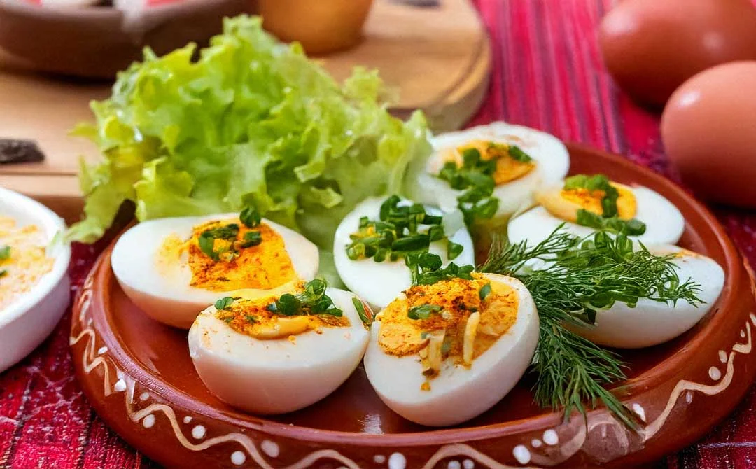 Spicy Ethnic Chilli Boiled Eggs – Quick & Easy Snack Ethnic Chilli Spiced Boiled Eggs garnished with vegetables